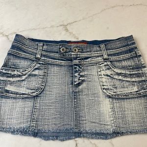 Denim miniskirt with embellishment on pockets